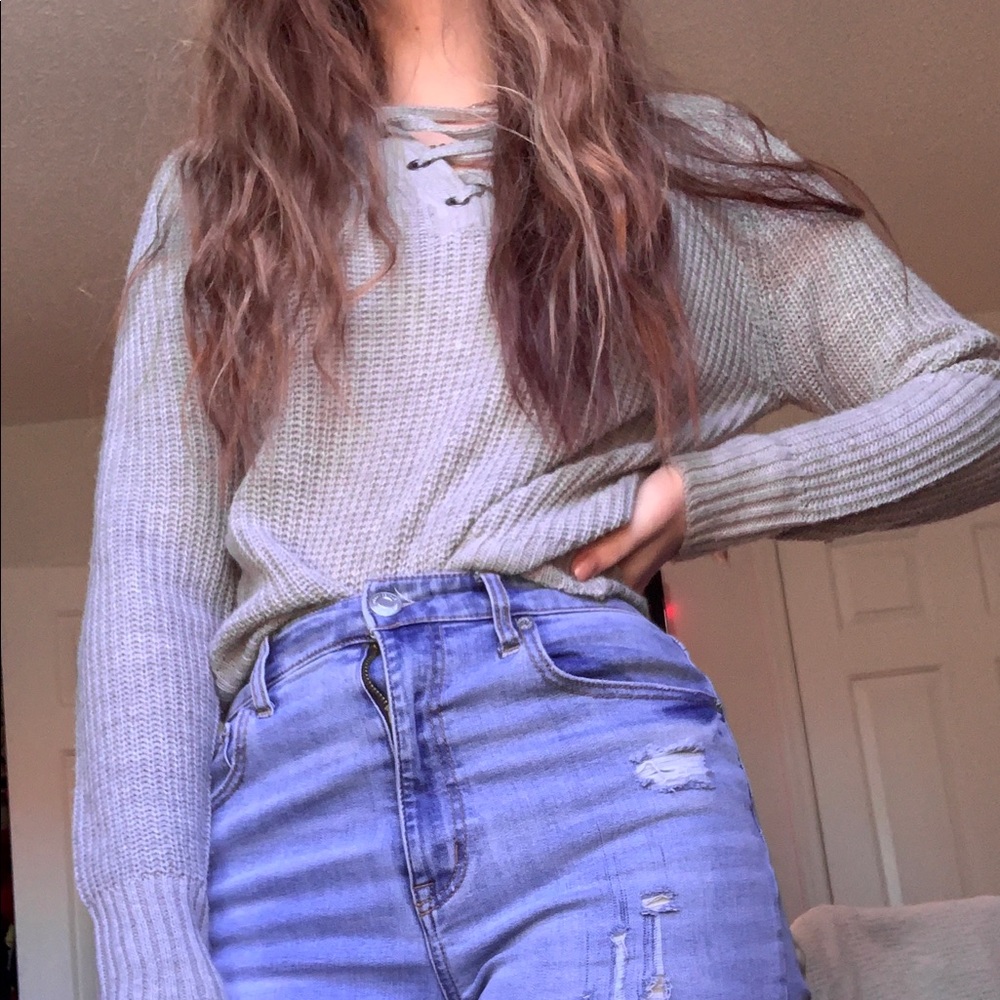 crisscrossing chest grey hooded sweater